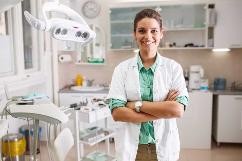 Female Dentist Standing in her Clinic | Smile Virtual