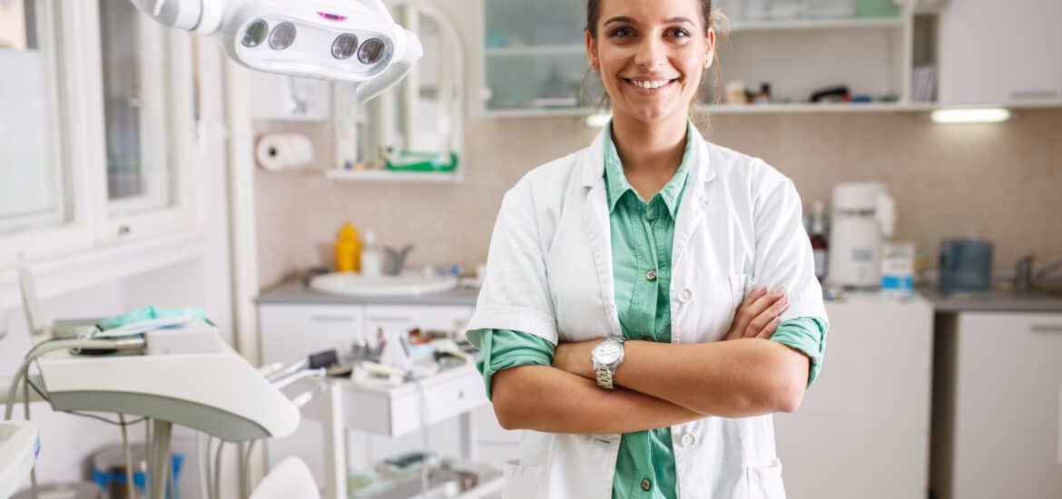 Female Dentist Standing in her Clinic | Smile Virtual