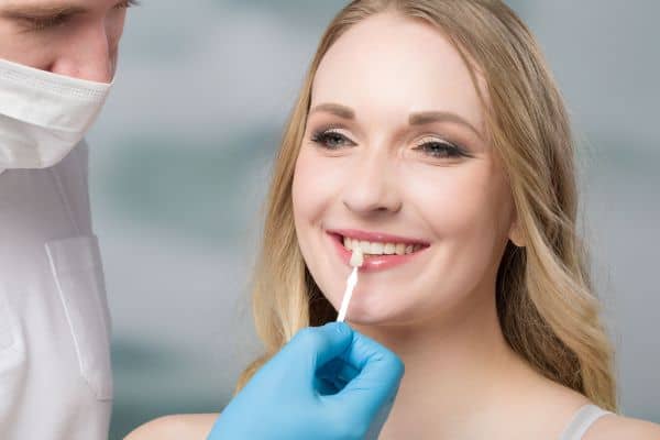 Attractive Woman Getting Porcelain Veneer Treatment on her Teeth | Smile Virtual
