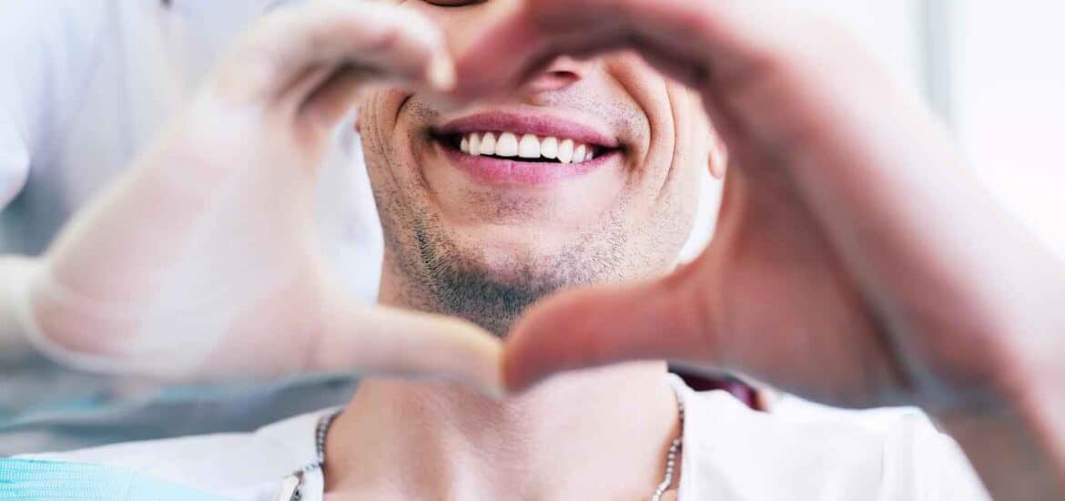 Male Patient Making Heart Shape with Hands | Smile Virtual