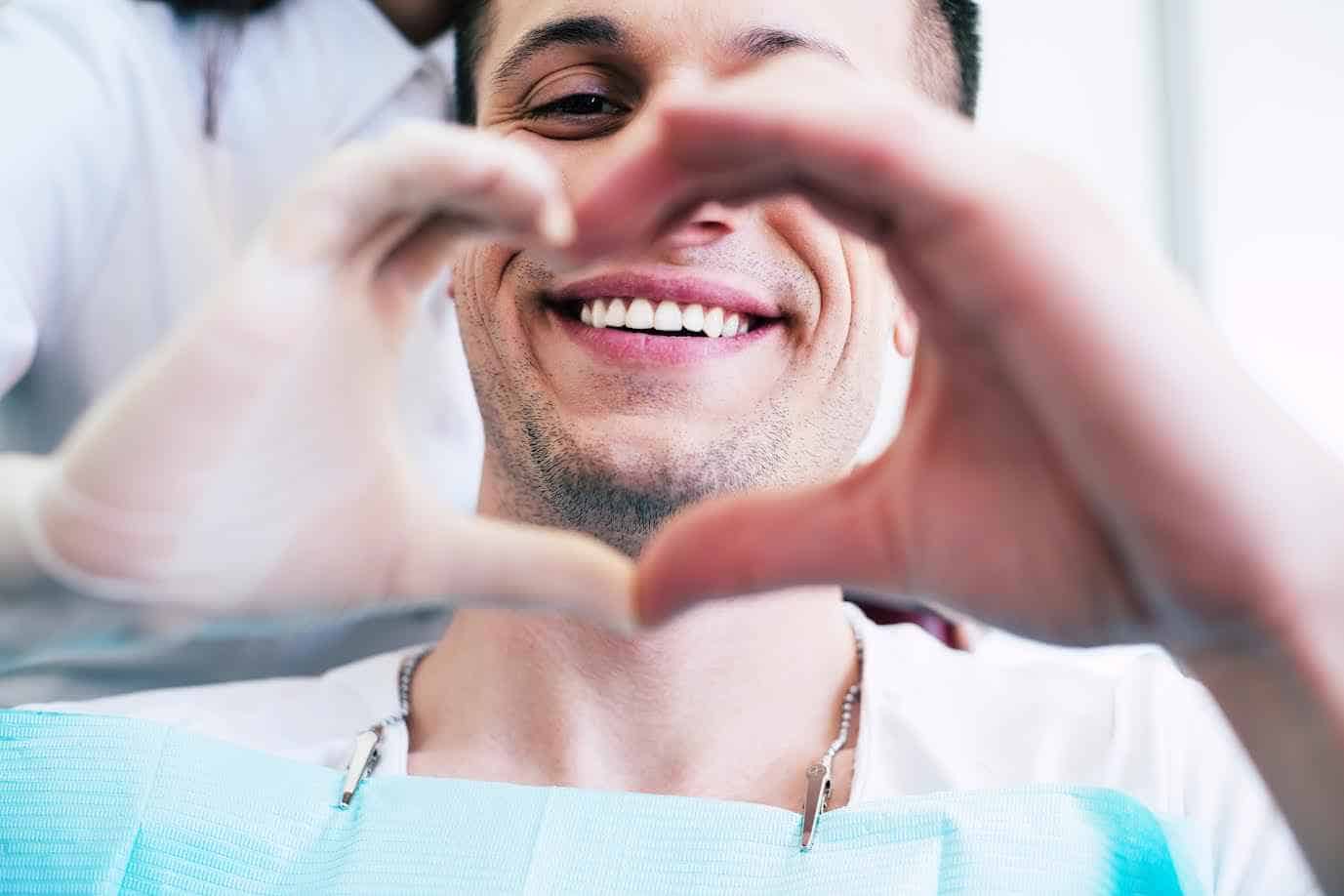 Male Patient Making Heart Shape with Hands | Smile Virtual