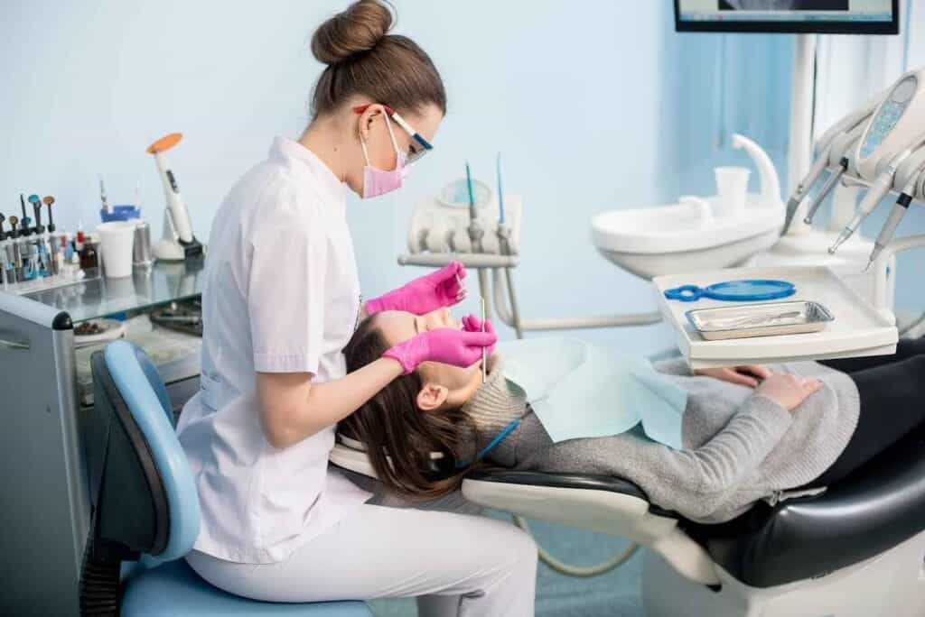 Young Woman Receiving Dental Implant Treatment at Clinic | Smile Virtual