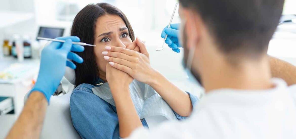 Young Female Cover her Mouth with her Hands & Afraid of Dental Treatment | Smile Virtual