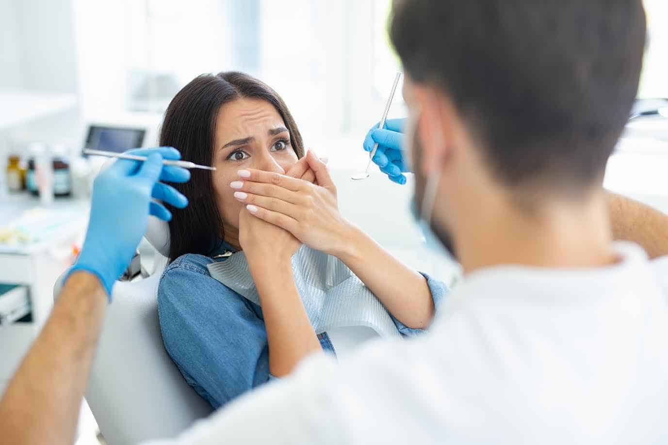 Young Female Cover her Mouth with her Hands & Afraid of Dental Treatment | Smile Virtual