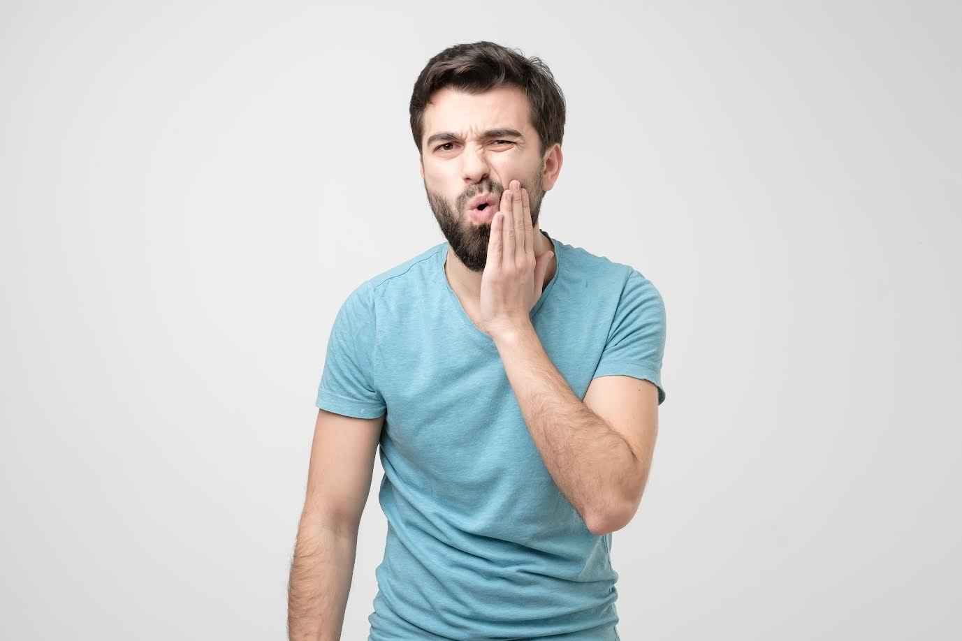 Man Showing Sensitivity on his Teeth | Smile Virtual