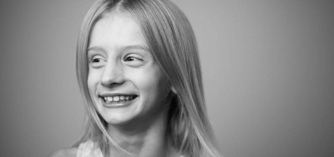Smiling Girl on Black and White Photo | Smile Virtual